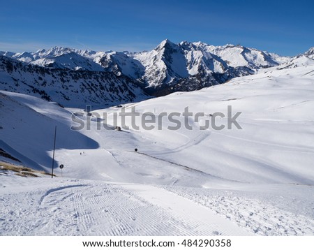 Ski piste across snow valley in the pyrenees mountains