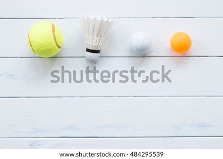 Tennis on white wood