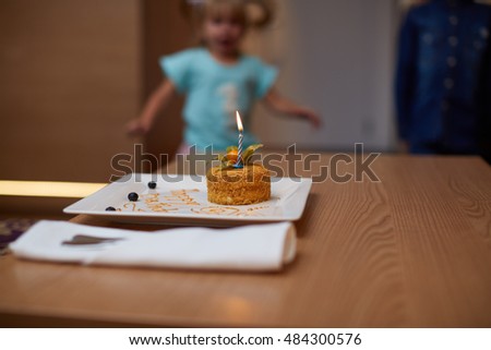Girl blowing out the candles