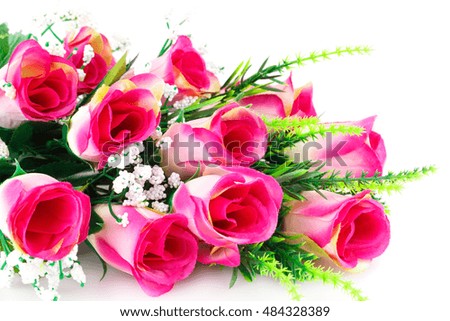 Pink fabric roses on white background.