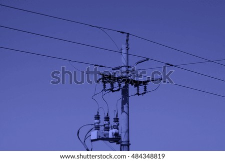 telegraph poles and power facilities under sky, closeup of photo