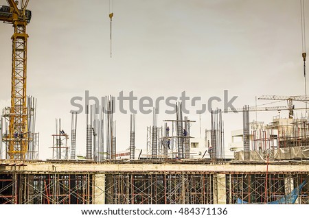 Construction site building and worker ,  take a photo pass a window , sky overcast