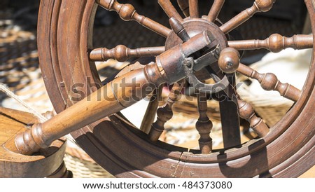 Antique, traditional spinning wheel for wool yarn, craft ancient instrument