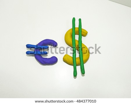 Currency signs made from plasticine. Abstraction on a white background.