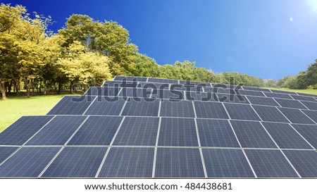 solar panels against mountain landscape against blue sky