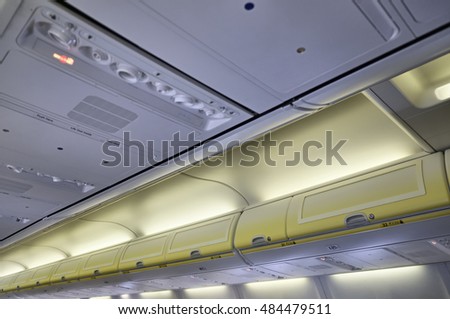Italy, airplane cabin with the no smoking signs on