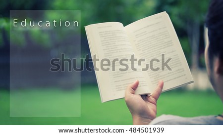 A man reading a book in garden,relaxing in garden home with outdoor,copy space for a add text on picture and wording "Education",Education concept and relaxing concept.
