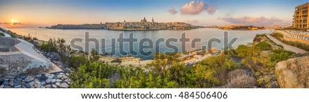 Valletta, Malta - Panoramic skyline view of the ancient city of Valletta with St.Pau's Cathedral and St. Elmo Bay early in the morning shot from Sliema