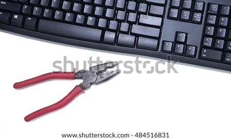 Close up image of  a hand tools and keyboard on white background. 
