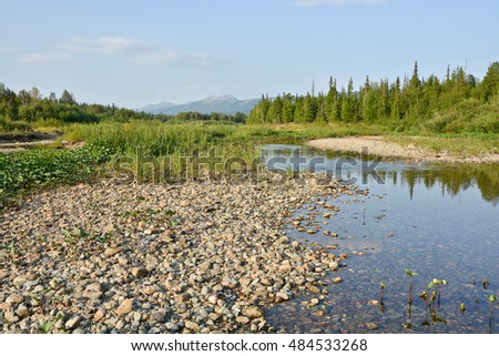 The pebbly shores of the river Shchugor in the national Park "Yugyd VA". The object of the world natural heritage site "Virgin Komi forests". Northern Urals, Russia.