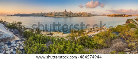 Valletta, Malta - Panoramic skyline view of the ancient city of Valletta with St.Pau's Cathedral and St. Elmo Bay early in the morning shot from Sliema