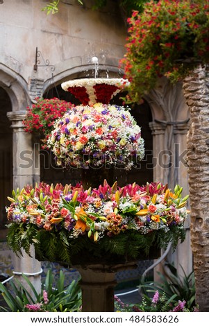 Feast of Corpus Christi. Egg on jet of water in the fountains decorated with flowers at gothic district of Barcelona