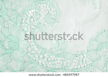 Turquoise lace texture background. Closeup