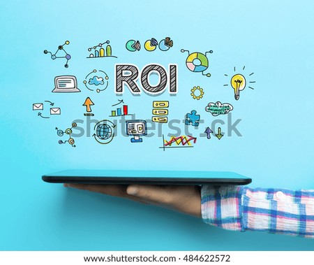 ROI concept with a tablet on blue background