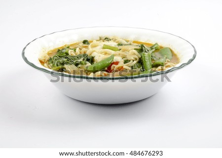 Delicious instant noodles with vegetables and egg. Copy space