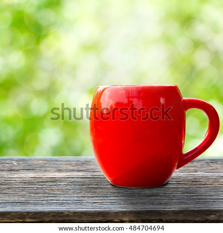 red coffee cup empty front porch the morning. Good morning or Have a happy day concept