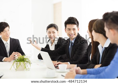 Group of happy young business people in  meeting Royalty-Free Stock Photo #484712134
