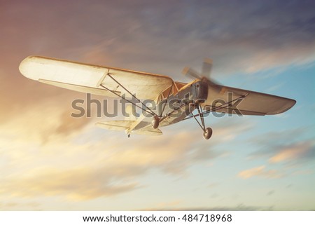 Old classic airplane on the air Royalty-Free Stock Photo #484718968