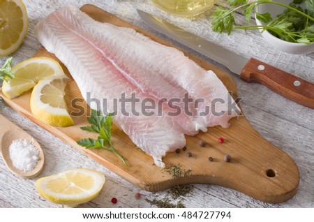 Fillet of fish on a kitchen board