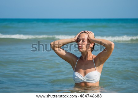 Cute brunette at the beach in Greece