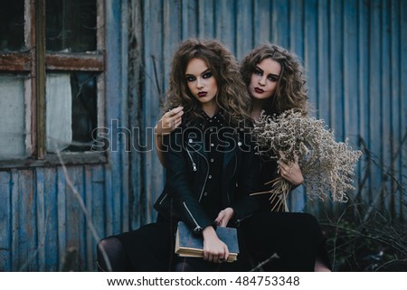 Two vintage witches gathered for the sabbat eve of Halloween