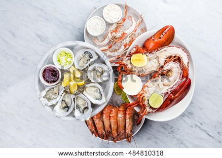 Fresh seafood platter with lobster,mussels and oysters  Royalty-Free Stock Photo #484810318