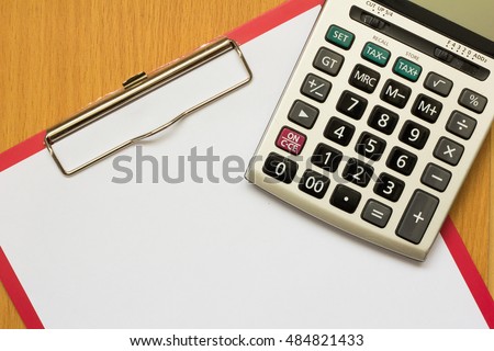 Paper on red file with calculator