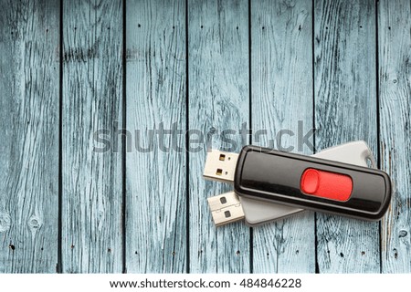 Usb flash drives on the wooden background
