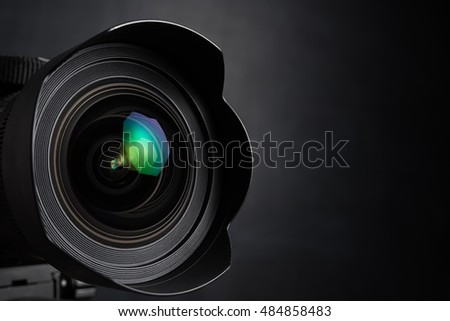 digital photo camera lens on black background