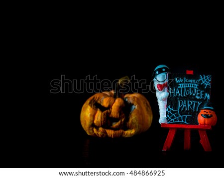 Welcome halloween party notice board on black background, blurred image pumpkin front Halloween party,