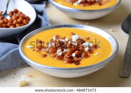 Pumpkin Soup with Chickpea, Bacon and Feta, selective focus