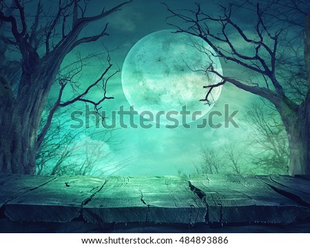 Halloween background. Spooky forest with full moon and wooden table Royalty-Free Stock Photo #484893886