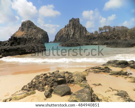 Beautiful view to Two Brothers Rock at Fernando de Noronha. Ocean in northeastern Brazil. Tropical beach with a coral reef.