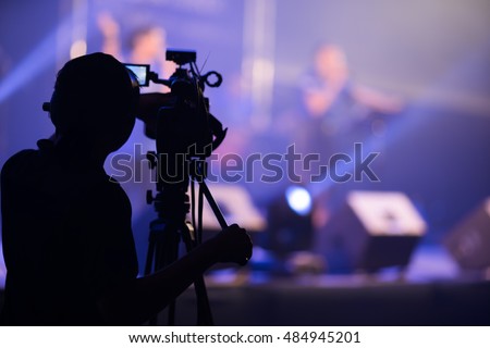 Blurred photo of Cameraman silhouette on a concert stage
 Royalty-Free Stock Photo #484945201