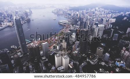 Aerial photo from flying drone of a Hong Kong advanced city view with most popular financial and business centers. Well developed infrastructure of buildings construction and urban transportation