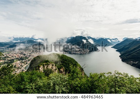 Beautiful panoramic view to Lugano city with its lake surrounded by mountains, swiss alps from San Salvatore, Ticino canton, Switzerland
