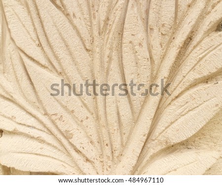 Textured background : traditional handcraft decoration of flowers on sandstone