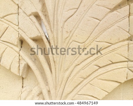 Textured background : traditional handcraft decoration of flowers on sandstone