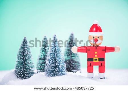 vintage Santa toy selecting Christmas trees in deep snow