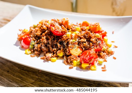 Rice salad on white plate