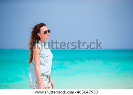 Young beautiful woman during tropical beach vacation