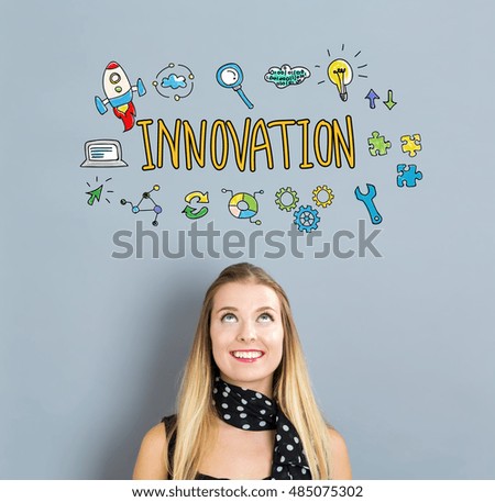 Innovation concept with happy young woman on a gray background