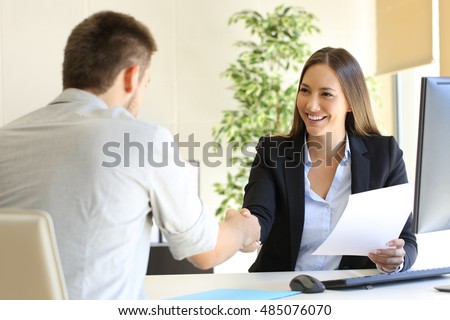Successful job interview with boss and employee handshaking Royalty-Free Stock Photo #485076070