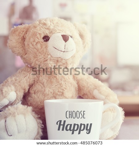 Massage on coffee cup,focused on teddy bear face in Blurred background with vintage filter