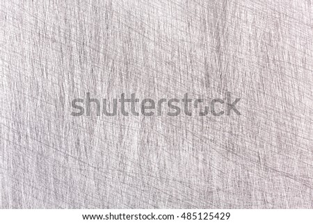 industrial grey steel plate with multiple scratches textured background