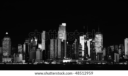 photo black and white new york city skyline cityscape from midtown manhattan at night. epic  beautiful b&w new york cityscape over the hudson river. 