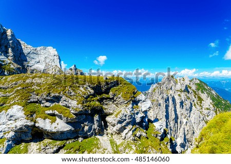 people in beautiful summer alpine mountain landscape