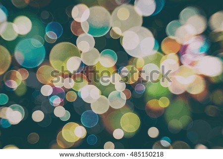 Christmas wallpaper decorations concept.Sparkle circle lit celebrations display.colored abstract blurred light background layout design.Festive elegant abstract background