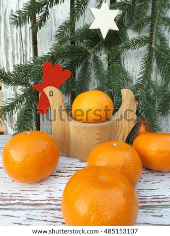 New Year's a symbol of 2017 - Cockerel. Tangerines and pine branches