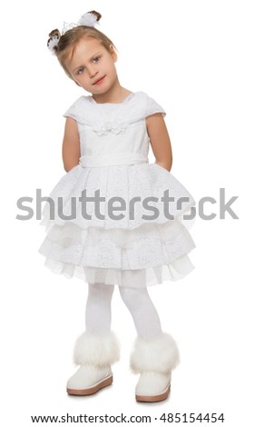 Gentle little Princess in a magnificent white dress. The girl is standing with his hands behind his back. She looks away from the camera - Isolated on white background
